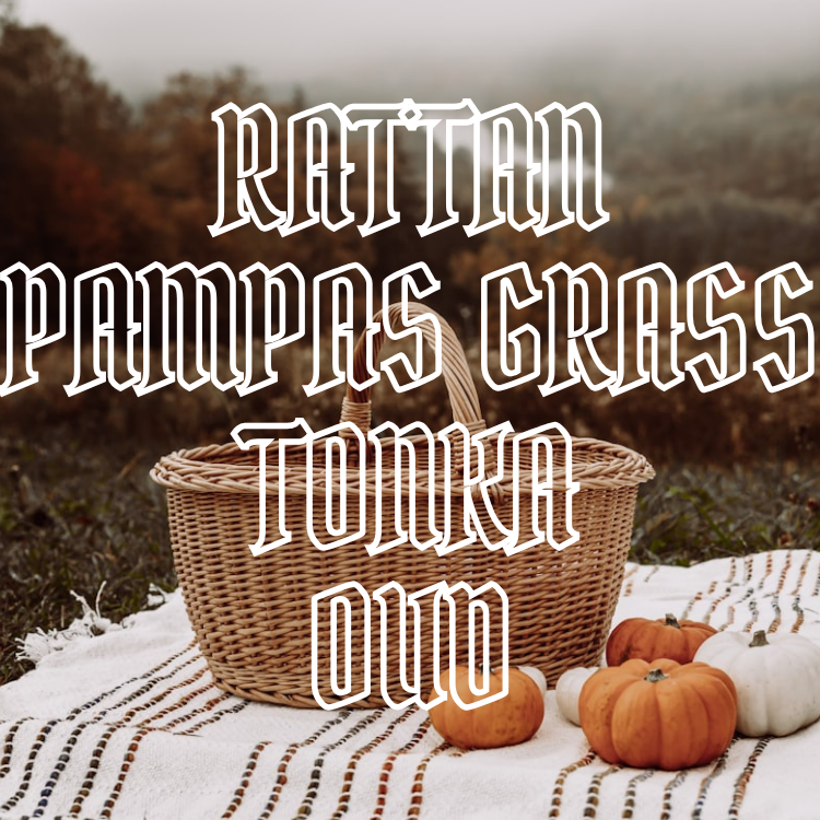 Rattan, pampas grass, tonka, and oud text overlaid on a wicker picnic basket on a blanket with pumpkins.