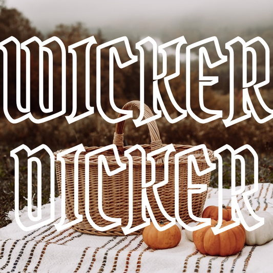 Wicker Dicker text overlaid on a wicker picnic basket on a blanket with pumpkins.