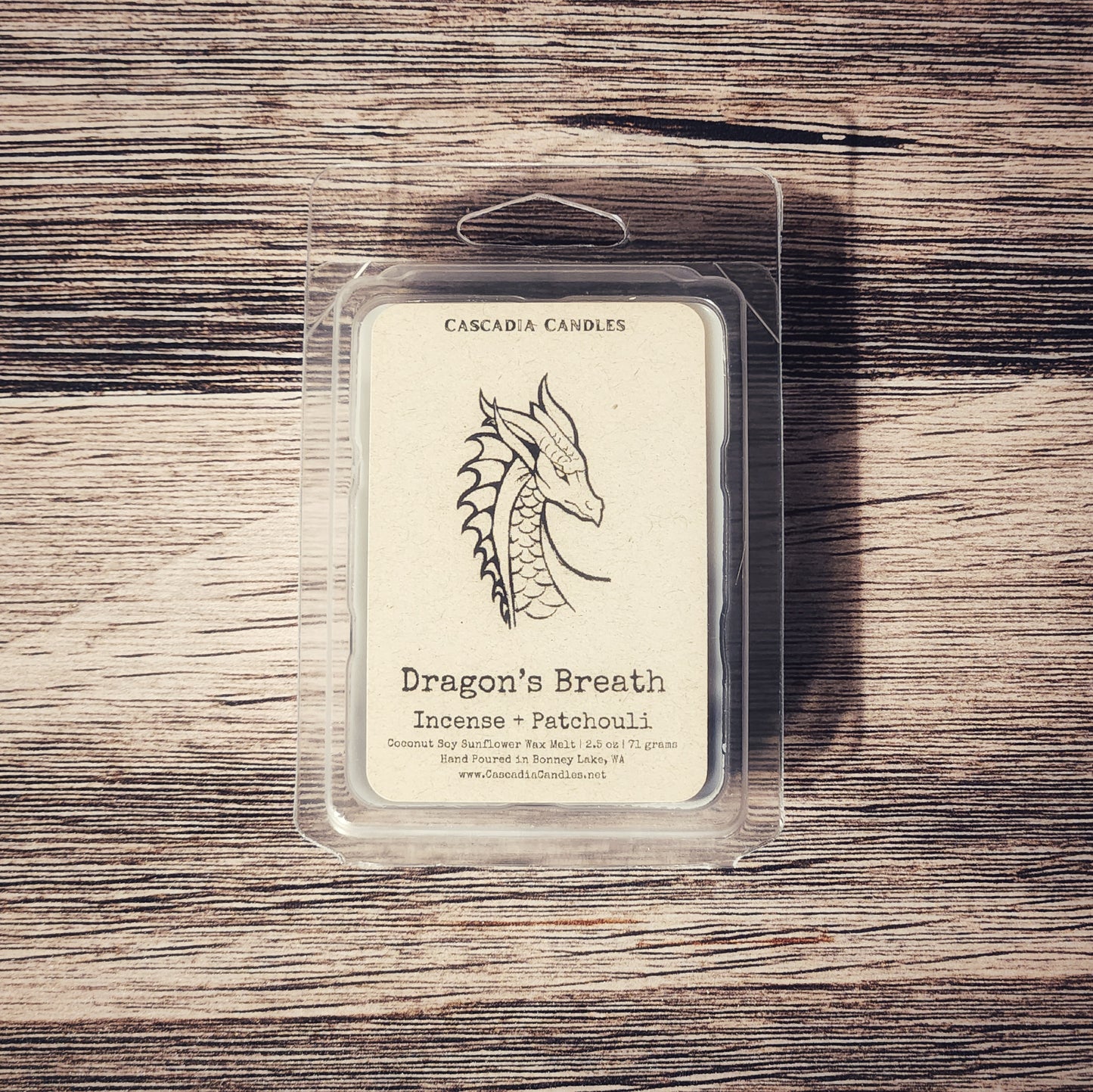 Cascadia Candles Dragon's Breath wax melt packaging on a wooden surface