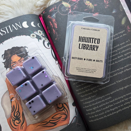 Wax melts in packaging with 'Haunted Library' label on a book background
