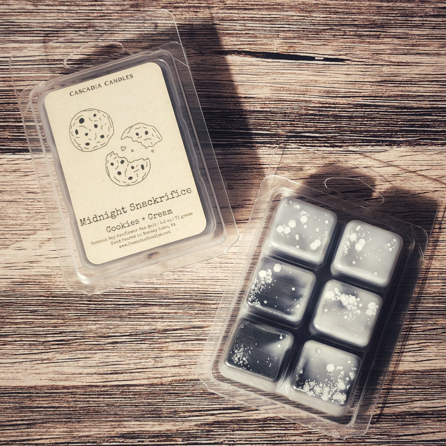Packaged wax melts with a label on a wooden surface