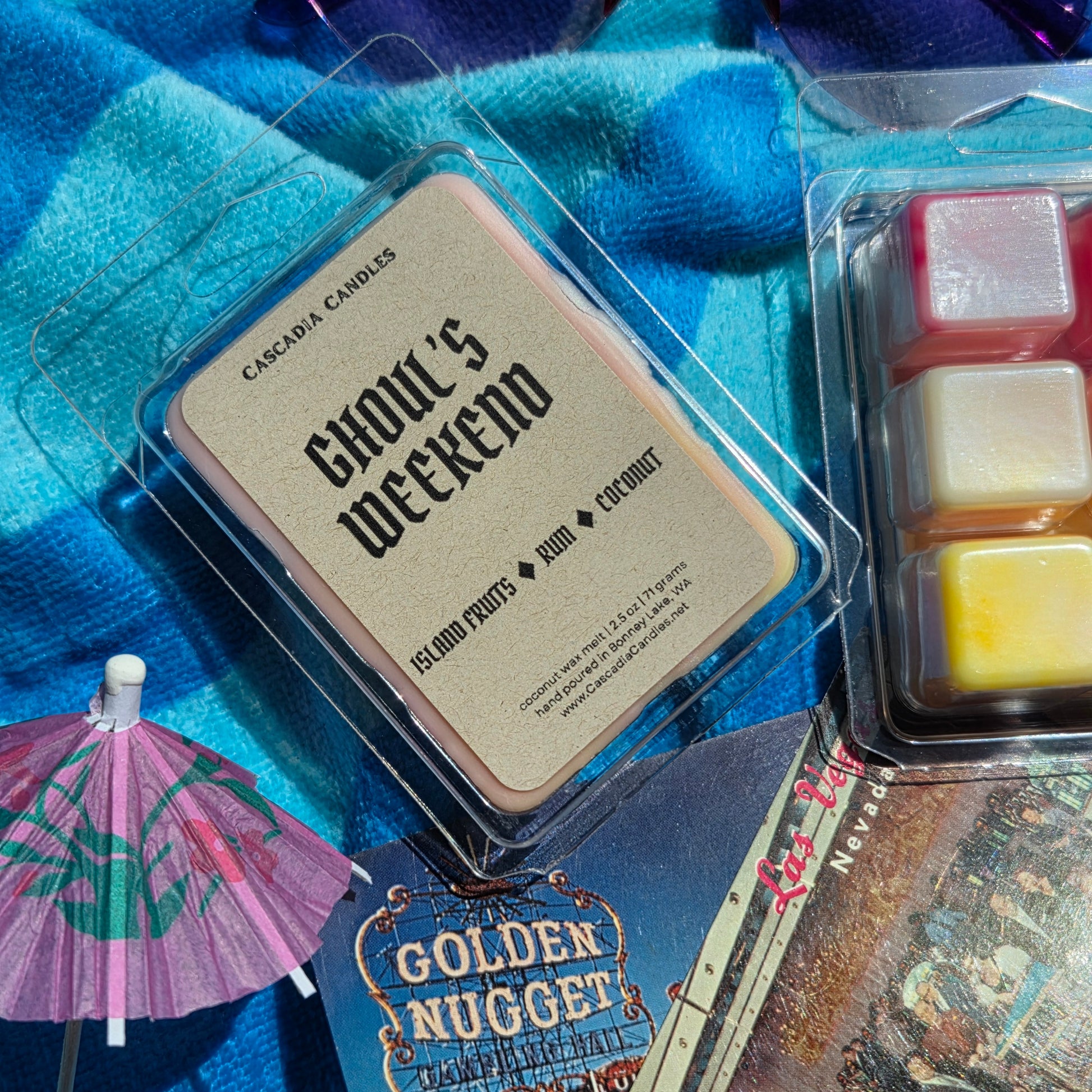 Wax melts in packaging with 'Ghoul's Weekend' text on a blue textured background