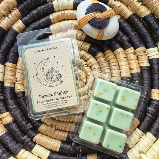 Packaged wax melts with 'Desert Nights' label on a woven surface