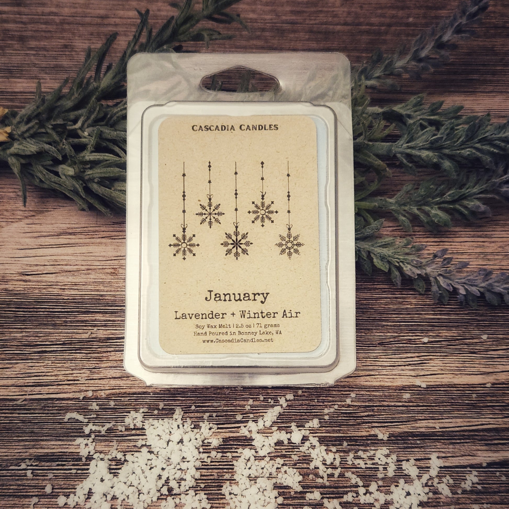 Cascadia Candles wax melt package with label on a wooden surface with greenery