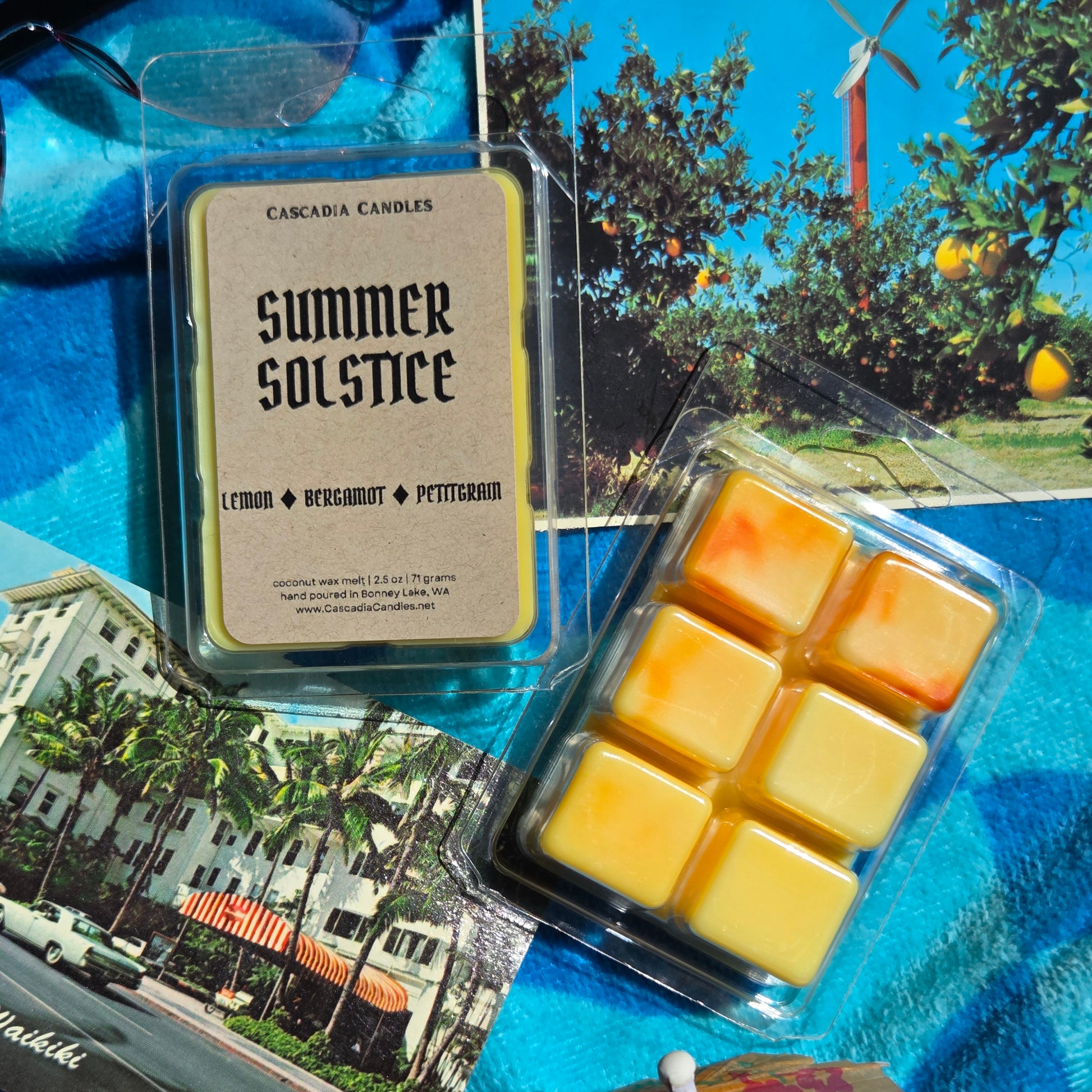 Packaged wax melts with 'Summer Solstice' label on a collage background