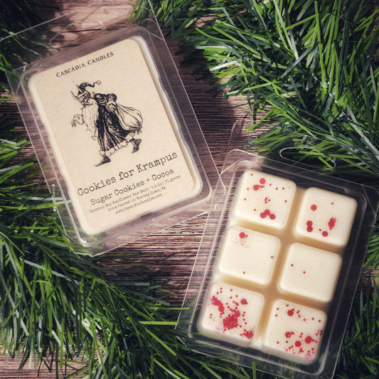 Cascadia Candles Cookies for Krampus wax melts on a wooden surface with greenery.