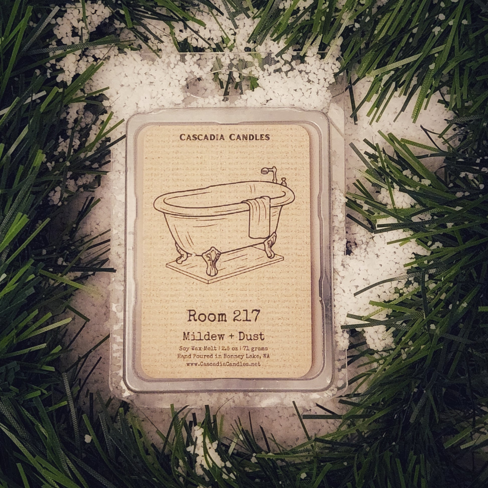 Cascadia Candles Room 217 packaging with bathtub illustration on a snowy grass background