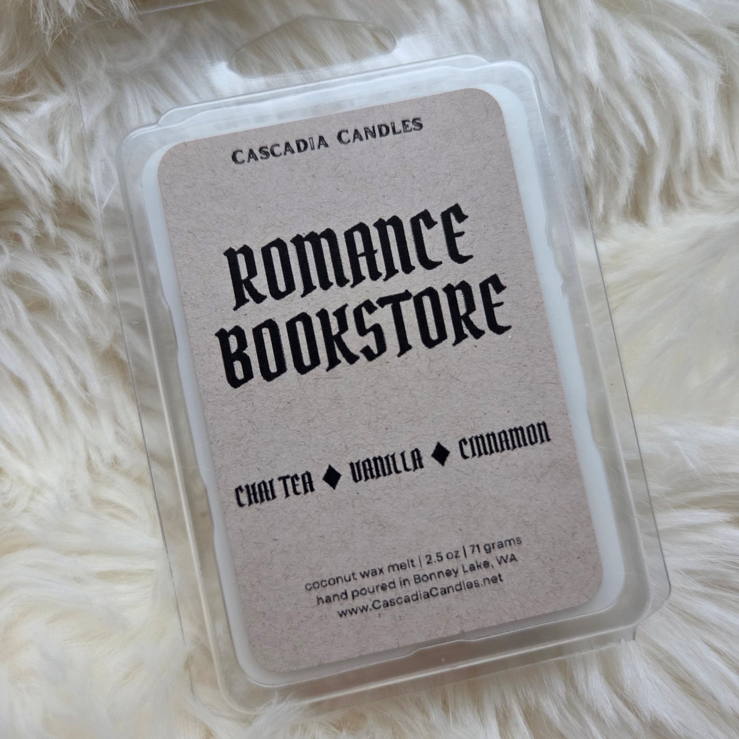 Cascadia Candles Romance Bookstore wax melt packaging on a fluffy white surface