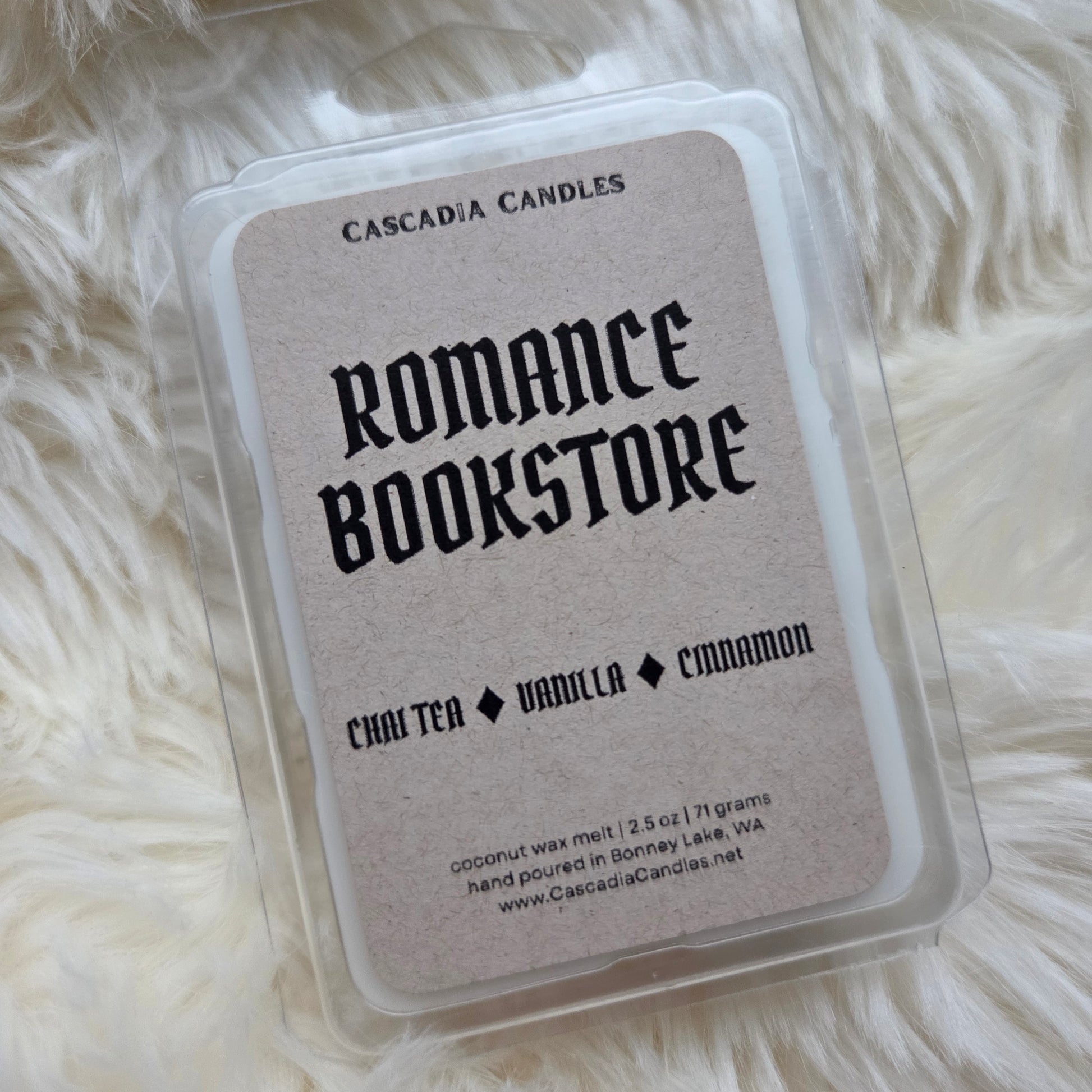 Cascadia Candles Romance Bookstore wax melt packaging on a fluffy white surface